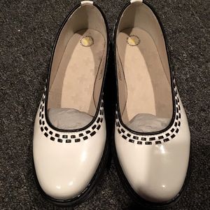 Dr. Martens “Kelly” white patent leather flats